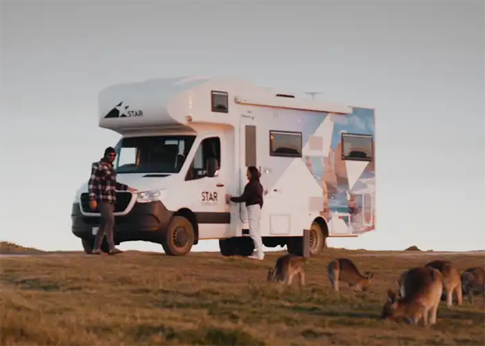 Polaris 6 with a couple admiring a group of wild kangaroos